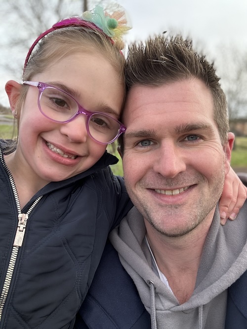 Christopher Abey with his daughter